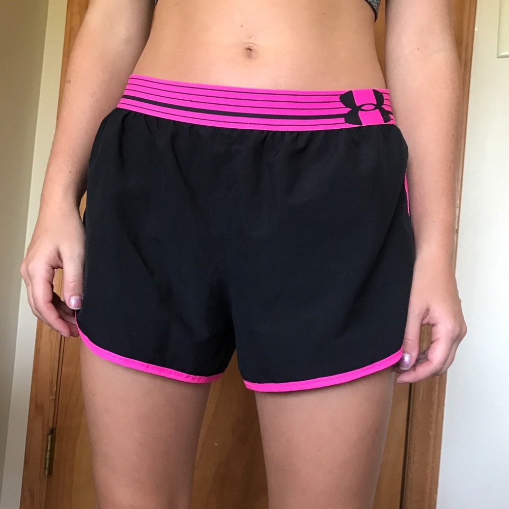 Women’s pink and black Under Armor running shorts
